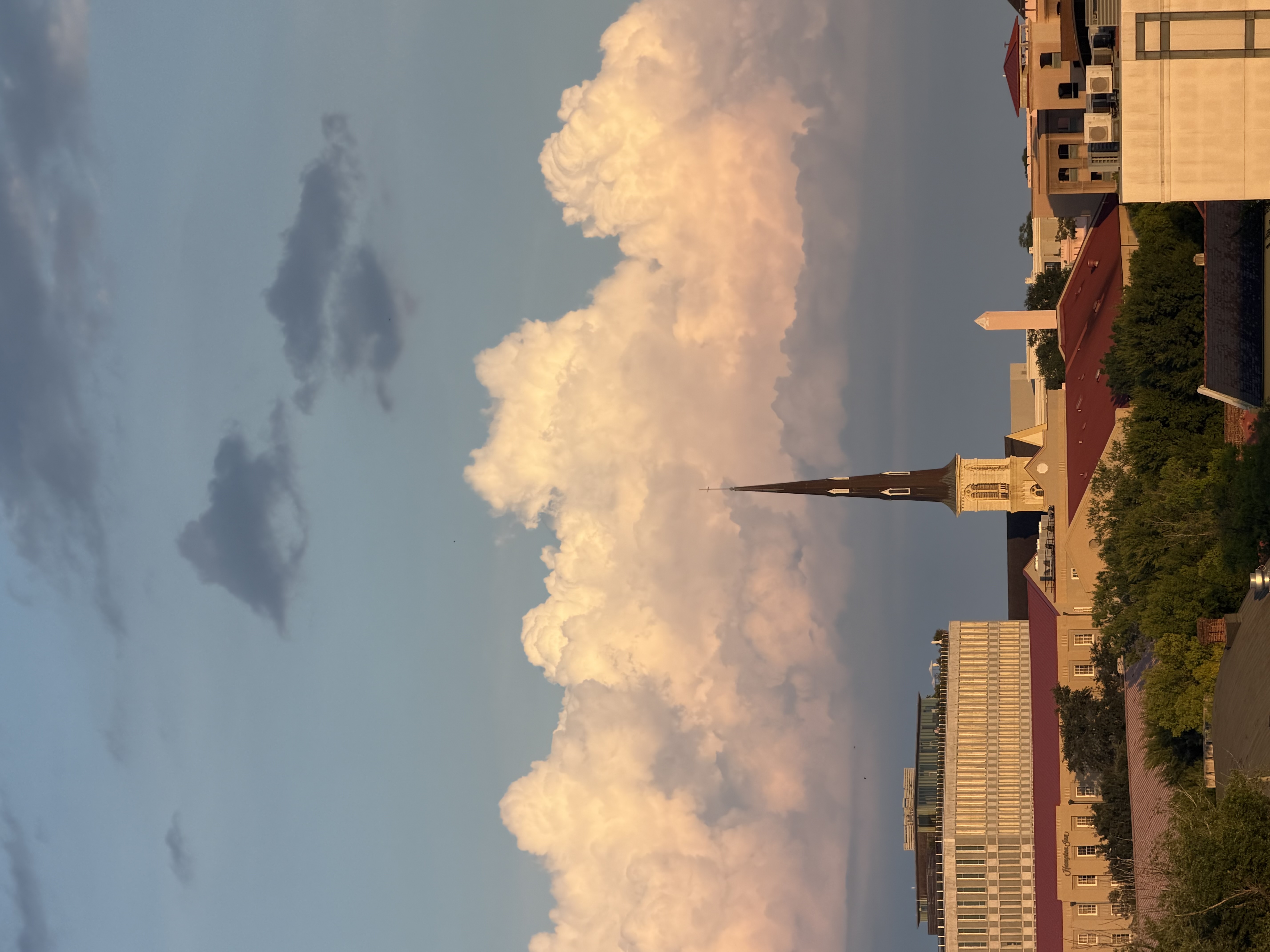 A Charleston church steeple against dramatic clouds