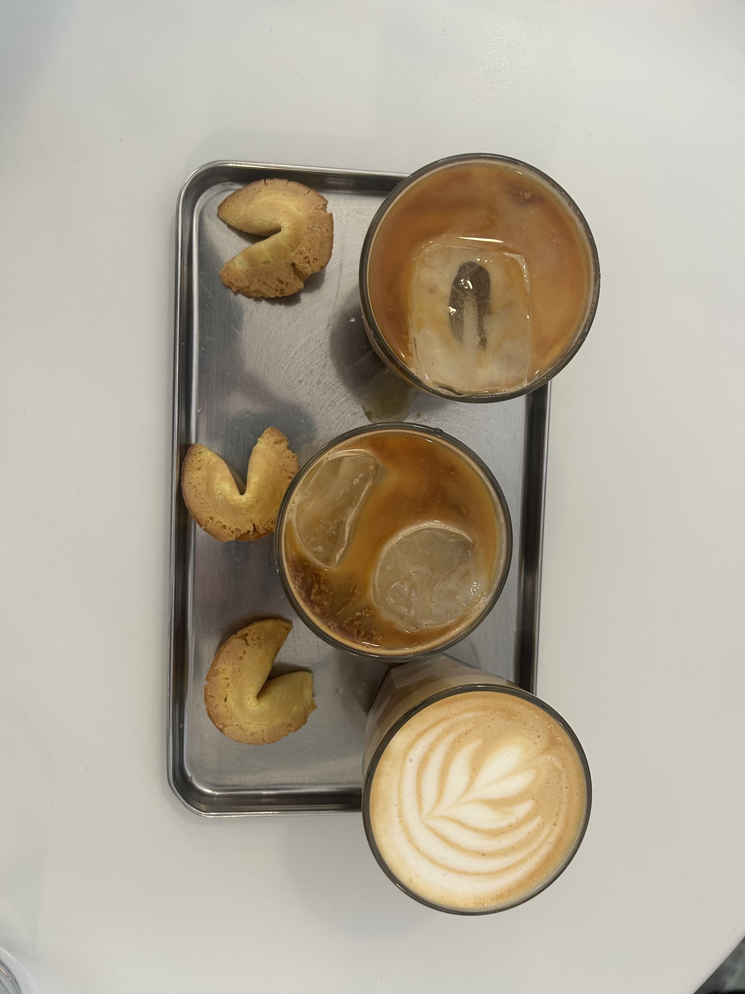 Iced coffee and butter cookies on a tray